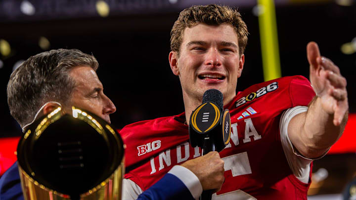 Indiana's Fernando Mendoza (15) talks to the crowd on the podium after the College Football Playoff National Championship college football game at Hard Rock Stadium in Miami Gardens on Monday, Jan. 19, 2026.
