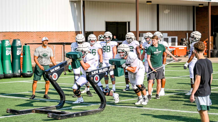 Michigan State defensive linemen participate in a drill during football practice on Wednesday, Aug.