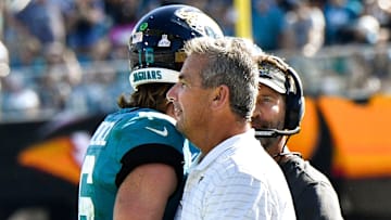 Oct 10, 2021; Jacksonville, FL, USA;   Jacksonville Jaguars head coach Urban Meyer congratulates quarterback Trevor Lawrence (16) after he scored a touchdown against the Tennessee Titans at TIAA Bank Field Sunday, Oct. 10, 2021.