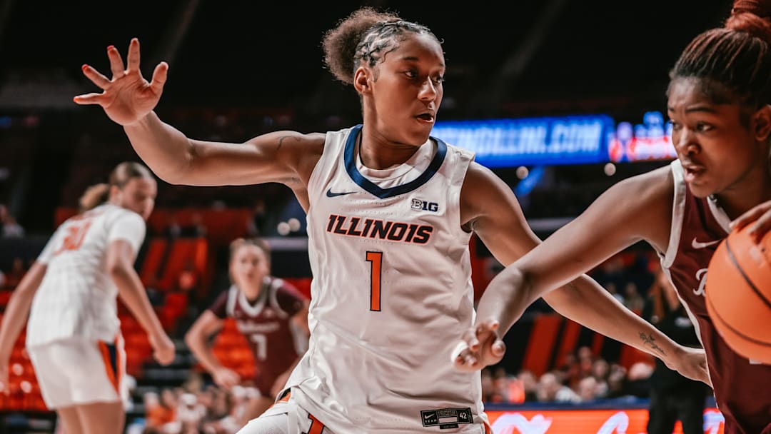 Illinois guard Aaliyah Guyton (1) locks up a Bellarmine ball-handler in the Illini's 90-41 win Tuesday at the State Farm Center in Champaign, Illinois.