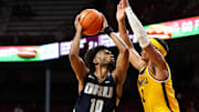 Nov 6, 2024; Minneapolis, Minnesota, USA; Oral Roberts Golden Eagles guard Issac McBride (10) drives towards the basket as Minnesota Golden Gophers guard Isaac Asuma (1) defends during the second half at Williams Arena. Mandatory Credit: Matt Krohn-Imagn Images