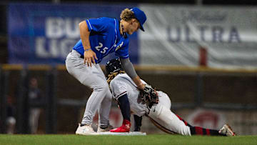 Biloxi Shuckers' Brock Wilken (25) attempts unsuccessfully to tag Mississippi Braves' Justin Dean (1) out during the game at Trustmark Park in Pearl, Miss., on the Brave's opening day, Tuesday, April 9, 2024. Braves won 2-0 after the game was called in the top of the eighth inning due to a tornado warning.