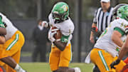 DeLand’s Marceles Carey (1) makes his way down the field with the ball during a game against Spruce Creek on Sept. 26, 2025. The unbeaten Bulldogs (10-0) host St. Johns Creekside in the Class 7A regional quarterfinals on Friday, Nov. 14.