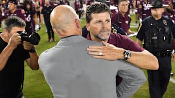 Sep 6, 2025; Blacksburg, Virginia, USA;  Vanderbilt Commodores head coach Clark Lea and Virginia Tech Hokies head coach Brent Pry after the game at Lane Stadium. Mandatory Credit: Brian Bishop-Imagn Images