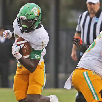 DeLand’s Marceles Carey (1) makes his way down the field with the ball during a game against Spruce Creek on Sept. 26, 2025. The unbeaten Bulldogs (10-0) host St. Johns Creekside in the Class 7A regional quarterfinals on Friday, Nov. 14.