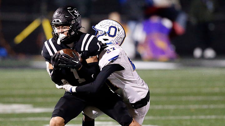 Ontario High School's Tre Fowler (27) tackles Perkins High School's Braylon Collier (1) during their OHSAA Division IV Region 14 championship high school football game Friday, Nov. 22, 2024 at Tiffin Frost Kalnow Stadium. TOM E. PUSKAR/MANSFIELD NEWS JOURNAL Ontario High School's Tre Fowler (27) tackles Perkins High School's Braylon Collier (1) during their OHSAA Division IV Region 14 championship high school football game Friday, Nov. 22, 2024 at Tiffin Frost Kalnow Stadium. TOM E. PUSKAR/MANSFIELD NEWS JOURNAL