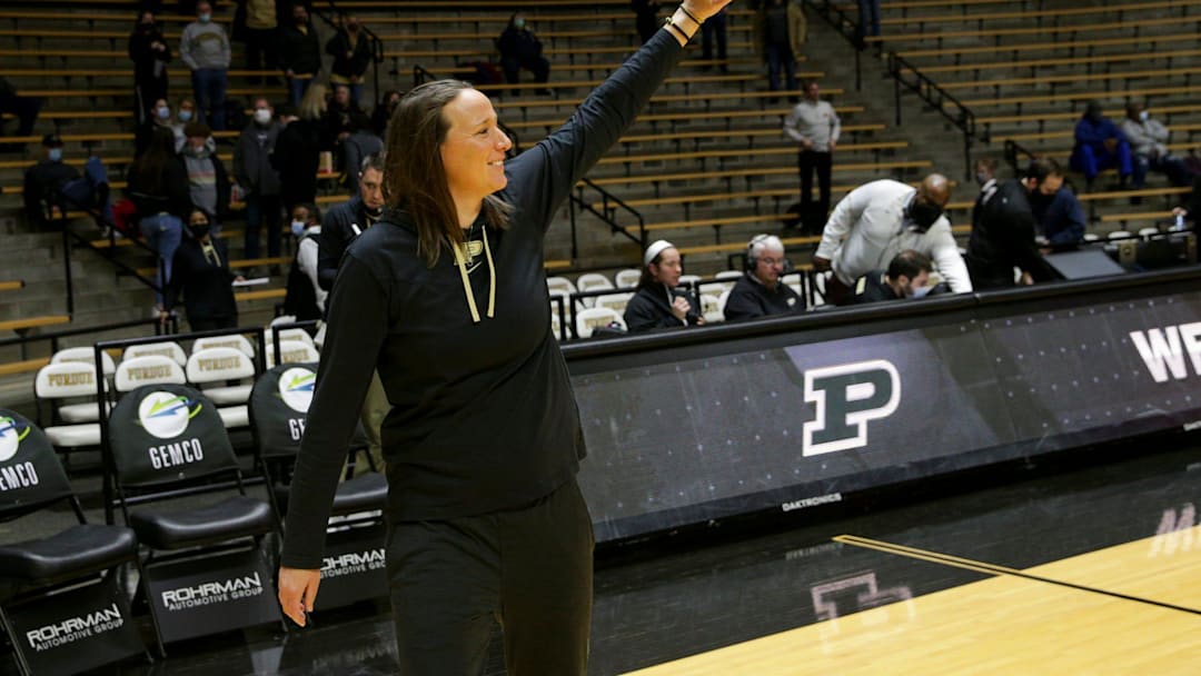 Purdue head coach Katie Gearlds waves at the fans.
