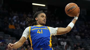 Jul 5, 2023; Sacramento, CA, USA; Golden State Warriors guard Yuri Collins (41) rebounds against the Charlotte Hornets during the third quarter at Golden 1 Center. Mandatory Credit: Darren Yamashita-Imagn Images