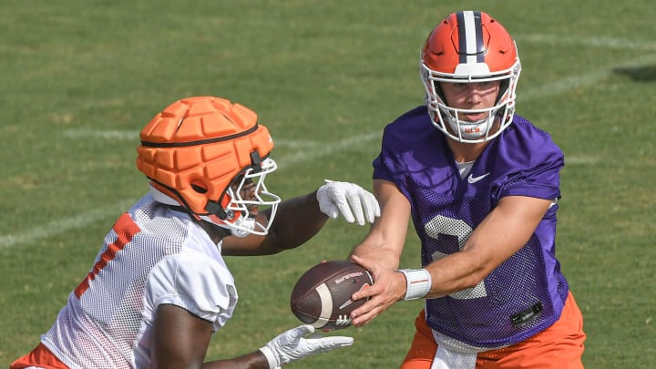 Clemson running back Phil Mafah (7) takes the handoff from quarterback Cade Klubnik (2) during the Clemson second August practice in Clemson, S.C. Friday August 2, 2024.