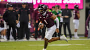 Sep 13, 2025; Blacksburg, Virginia, USA;  Virginia Tech Hokies cornerback Dante Lovett (1) runs the ball during the first quarter at Lane Stadium. Mandatory Credit: Brian Bishop-Imagn Images