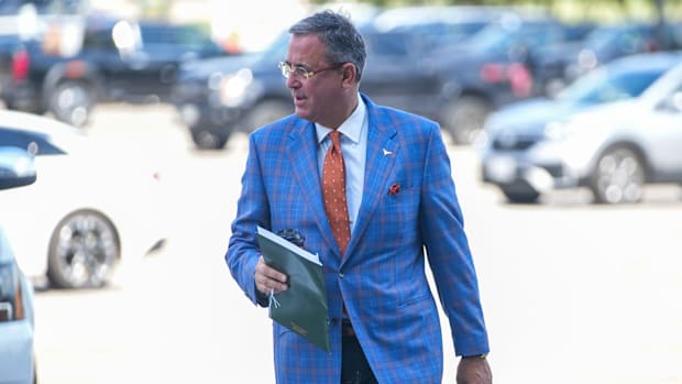 Texas Longhorns athletic director Chris Del Conte makes his way into the stadium of an NCAA college football game.