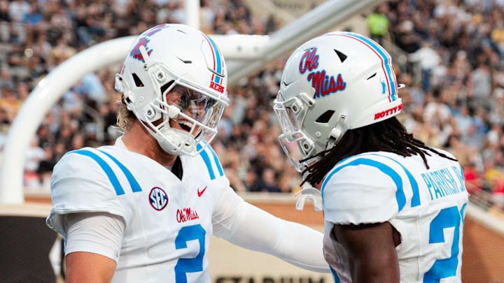 Jaxson Dart and Henry Parrish Jr. celebrate during Saturday's game at Wake Forest.