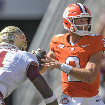 Sep 23, 2023; Clemson, South Carolina, USA; Florida State Seminoles linebacker Karen DeLoach (4) hits Clemson Tigers quarterback Cade Klubnik (2) To knock the ball loose before picking up the fumble and returning it for a touchdown during the third quarter at Memorial Stadium. Mandatory Credit: Ken Ruinard-USA TODAY Sports