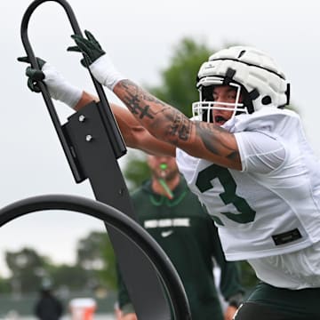 MSU's Isaac Smith works a sled, Tuesday, July 29, 2025, during the first day of football practice at the Skandalaris Football Center.