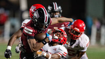 Germantown Mavericks' wide receiver KeyShaun Coleman (13) runs the ball during the game against the Warren Central Vikings in Madison, Miss., on Friday, Sept. 13, 2024.