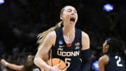 UConn Huskies guard Paige Bueckers celebrates after beating the USC Trojans in the finals of the Portland Regional of the NCAA Tournament at the Moda Center.