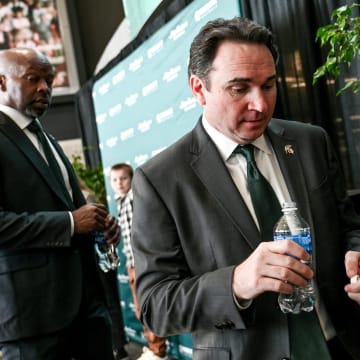 Michigan State football coach Jonathan Smith leaves the stage after speaking during an introductory press conference on Tuesday, Nov. 28, 2023, at the Breslin Center in East Lansing.