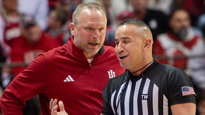 Indiana Head Cozch Darian DeVries talks with an official during the Indiana versus Wisconsin men's basketball game at Simon Skjodt Assembly Hall on Saturday, Feb. 7, 2026.
