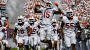 Sep 20, 2025; Blacksburg, Va.; Virginia Tech safety Brennan Johnson (15) celebrates as he enters the stadium.