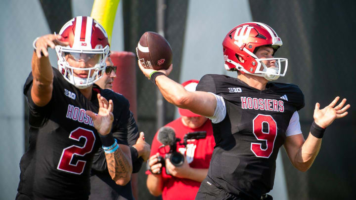 Indiana quarterbacks Tayven Jackson (2) and Kurtis Rourke (9) throw  during fall practice.