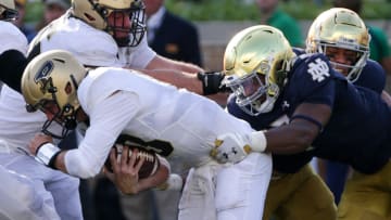 Notre Dame defensive lineman Isaiah Foskey (7) tackles Purdue quarterback Jack Plummer (13) during the fourth quarter of an NCAA football game, Saturday, Sept. 18, 2021 at Notre Dame Stadium in South Bend. Nikos Frazier / Journal & Courier
