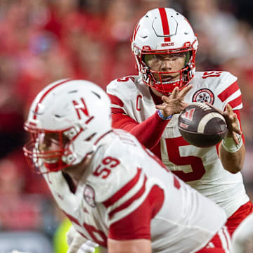Nebraska guard Henry Lutovsky helps protect quarterback Dylan Raiola.