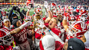 Indiana's Mike Katic (56) and the Hoosiers hoist the Old Oaken Bucket after the Indiana versus Purdue football game at Memorial Stadium on Saturday, Nov. 30, 2024.