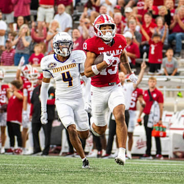 Indiana's Elijah Sarratt (13) runs for a touchdown during the Indiana versus Western Illinois football game at Memorial Stadium on Friday, Sept. 6, 2024.