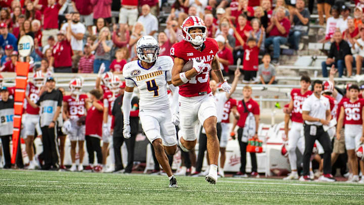 Indiana's Elijah Sarratt (13) runs for a touchdown during the Indiana versus Western Illinois football game at Memorial Stadium on Friday, Sept. 6, 2024.