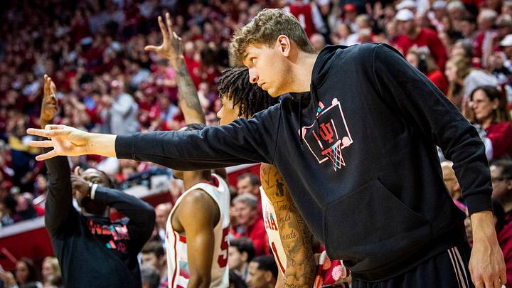 Indiana's Logan Duncomb (51) and the Indiana bench celebrate a Miller Kopp three-pointer during the second half of the Indiana versus Rutgers men's basketball game at Simon Skjodt Assembly Hall on Tuesday, Feb. 7, 2023.

Iu Ru Mbb 2h Duncan 1