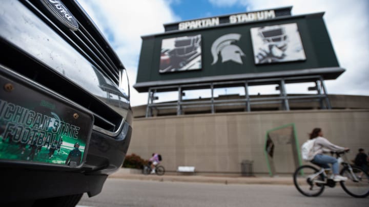 Ousted MSU football coach Mel Tucker is featured on an Michigan State Football license plate on a