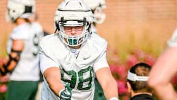 Michigan State's Avery Dunn runs a drill during the opening day of fall camp on Thursday, Aug. 5, 2021, on the MSU campus in East Lansing.

210805 Msu Fball Camp 043a