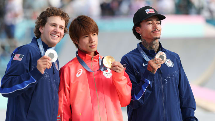 Jagger Eaton, Yuto Horigome and Nyjah Huston pose with their medals after the men's street skateboarding final at the 2024 Olympics in Paris.