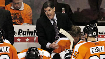 May 12, 2010; Philadelphia, PA USA;  Philadelphia Flyers coach Peter Laviolette talks to his team during the 3rd period of game six of the Eastern Conference semifinals against the Boston Bruins at the Wachovia Center in Philadelphia. The Flyers defeated the Burins 2-1. Mandatory Credit: Eric Hartline-Imagn Images