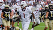 Sep 20, 2025; Blacksburg, Va.; Virginia Tech quarterback Kyron Drones (1) runs the ball for a touchdown against Wofford.