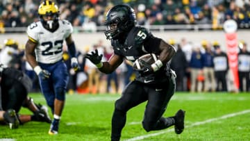 Michigan State's Nathan Carter runs the ball against Michigan during the third quarter on Saturday, Oct. 21, 2023, at Spartan Stadium in East Lansing.