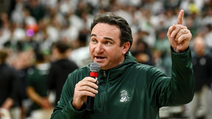 Michigan State's new football coach Jonathan Smith speaks to the crowd during a timeout in the basketball game against Georgia Southern on Tuesday, Nov. 28, 2023, at the Breslin Center in East Lansing.