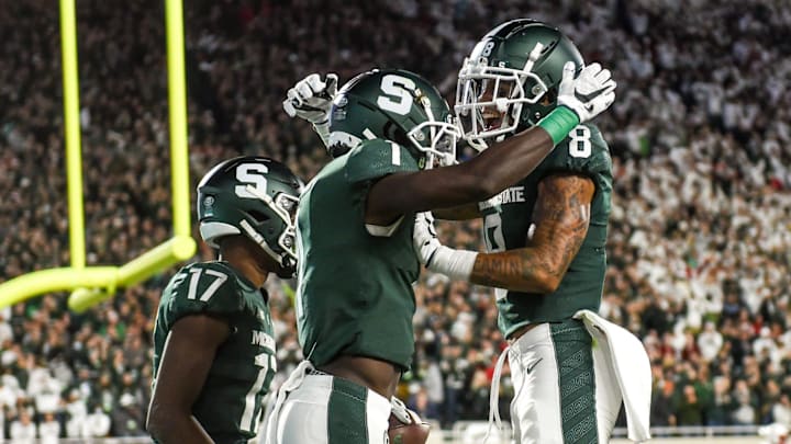 Michigan State's Jayden Reed, left, celebrates his touchdown against  Nebraska with teammate Jalen Nailor during the second quarter on Saturday, Sept. 25, 2021, at Spartan Stadium in East Lansing.

210925 Msu Nebraska 124a