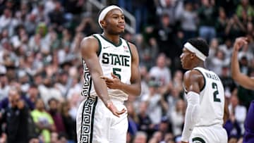 Michigan State's Tre Holloman celebrates after sinking free throws against Northwestern during the
