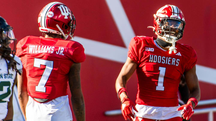 Indiana's Donaven McCulley (1) celebrates his long gain during the second half of the Indiana versus Michigan State football game at Memorial Stadium on Saturday, Nov. 18, 2023. Also pictured is E.J. Williams Jr. Both receivers return in 2024.