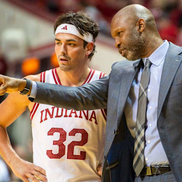 Indiana Director of Player Development Calbert Cheaney talks with Trey Galloway (32) during the Indiana versus Miami (Ohio) men's basketball game at Simon Skjodt Asseembly Hall on Friday, Dec. 6, 2024.