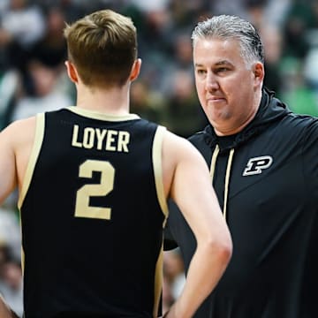 Purdue's head coach Matt Painter talks with Fletcher Loyer during the first half in the game against Michigan State 