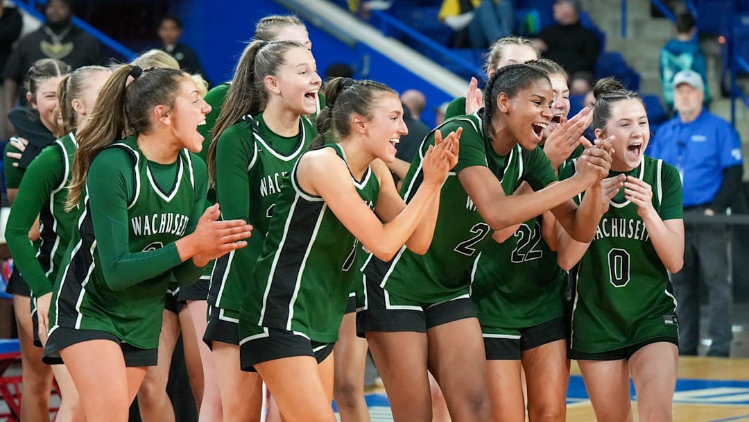Wachusett players celebrate winning the Division 1 state championship after defeating Springfield Central March 14 at the Tsongas Center in Lowell.
