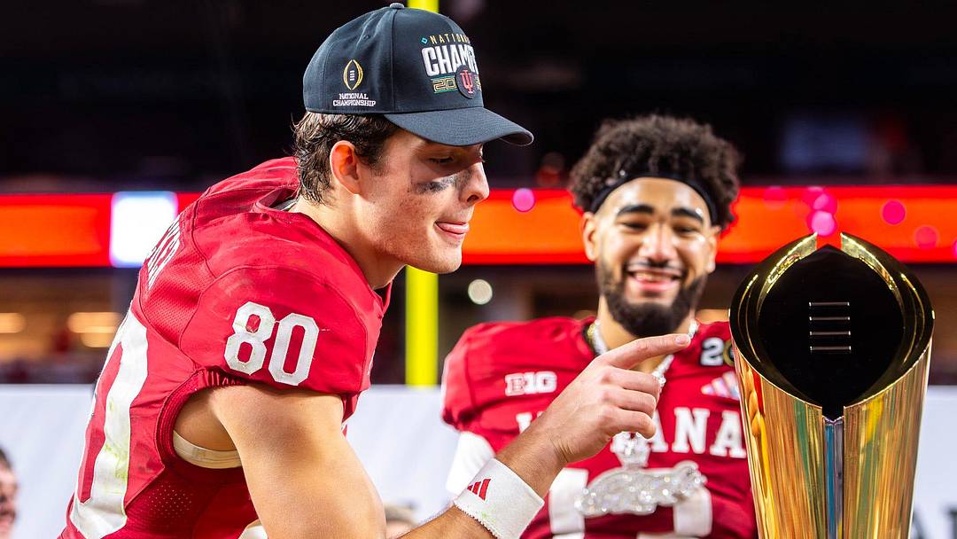 Indiana's Charlie Becker (80) touches the trophy after the College Football Playoff National Championship college football game at Hard Rock Stadium in Miami Gardens on Monday, Jan. 19, 2026.
