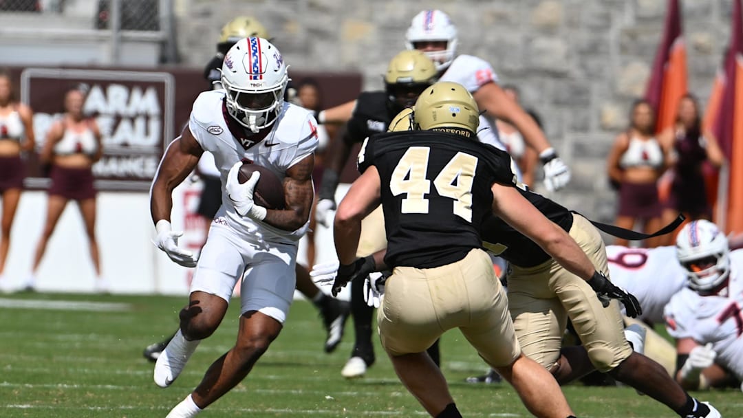 Sep 20, 2025; Blacksburg, Va.; Virginia Tech running back Jeremiah Coney (4) runs the ball against Wofford.