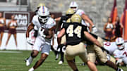 Sep 20, 2025; Blacksburg, Va.; Virginia Tech running back Jeremiah Coney (4) runs the ball against Wofford.