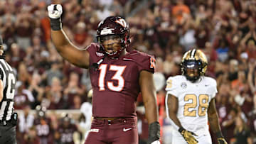 Sep 6, 2025; Blacksburg, Virginia, USA; Virginia Tech Hokies defensive lineman Kemari Copeland (13) celebrates a defensive stop during the first quarter at Lane Stadium. Mandatory Credit: Brian Bishop-Imagn Images