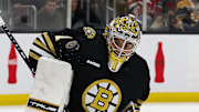 Jan 15, 2024; Boston, Massachusetts, USA; Boston Bruins goaltender Jeremy Swayman (1) makes a shoulder save against the New Jersey Devils during the second period at TD Garden. Mandatory Credit: Winslow Townson-Imagn Images