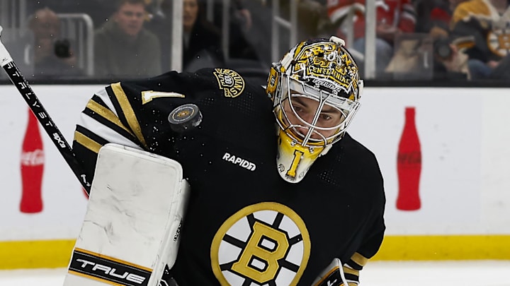 Jan 15, 2024; Boston, Massachusetts, USA; Boston Bruins goaltender Jeremy Swayman (1) makes a shoulder save against the New Jersey Devils during the second period at TD Garden. Mandatory Credit: Winslow Townson-Imagn Images