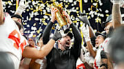 Ohio State's Ryan Day (center) joins Urban Meyer, Jim Tressel, Woody Hayes and Paul Brown in the select fraternity of national champion coaches at Ohio State.